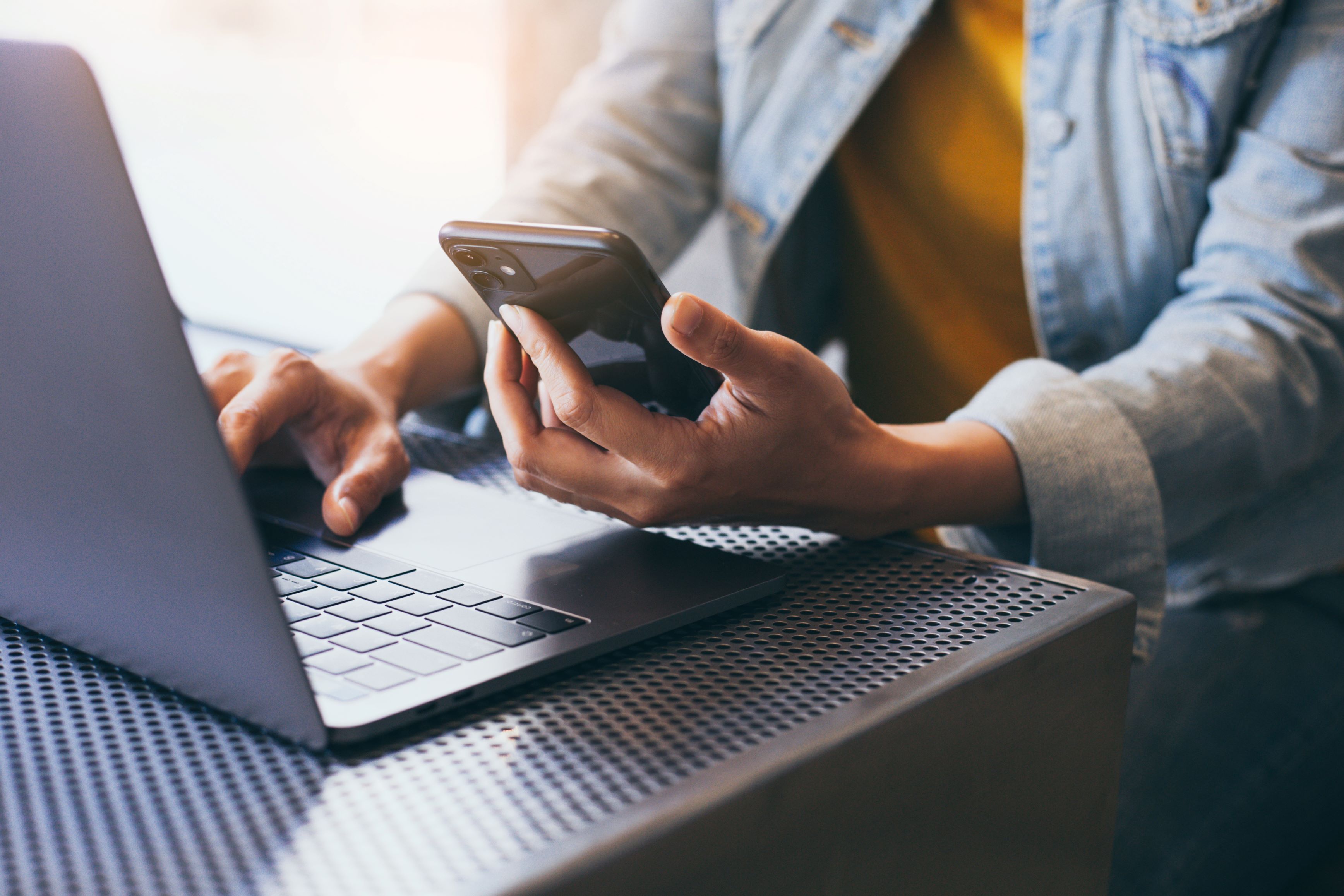 work using texting cell phone typing computer.chatting on mobile,laptop contact us at workplace